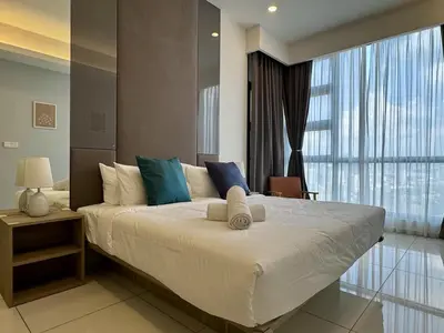 a bedroom with a large bed and a large window at Balcony Cityscape IIII The Robertson Residence 42f in Kuala Lumpur