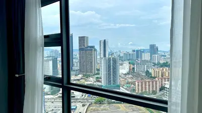 a view of a city skyline from a window at Balcony Cityscape IIII The Robertson Residence 42f in Kuala Lumpur