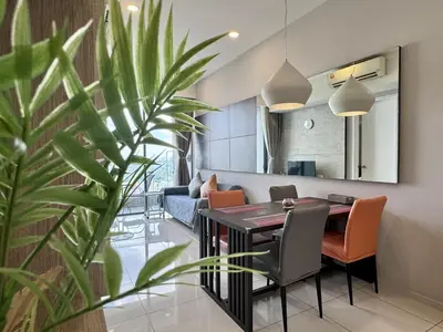 a dining room and living room with a table and chairs at Balcony Cityscape IIII The Robertson Residence 42f in Kuala Lumpur