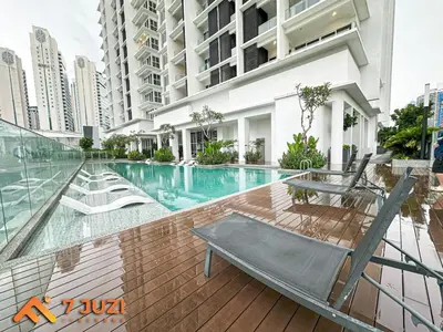a swimming pool in a building with a chair at Quill Suite 1R1B Netflix HD1080 with Infinity Pool in Kuala Lumpur