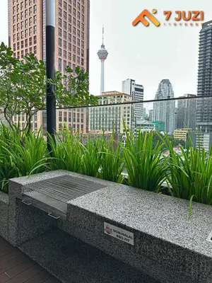 a stone bench with a view of a city at Quill Suite 1R1B Netflix HD1080 with Infinity Pool in Kuala Lumpur