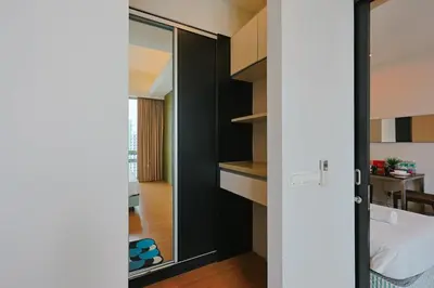 an open door to a room with a kitchen at Swiss Garden Residence by Aspire Suites in Kuala Lumpur