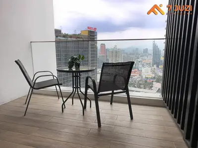 a table and chairs on a balcony with a view at Quill Residence 1R1B with Netflix 23F&Massive Pool in Kuala Lumpur
