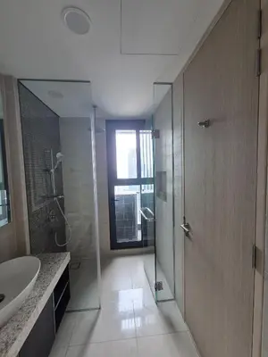 a bathroom with a shower and a sink and a mirror at Star Residence Sky World KLCC in Kuala Lumpur