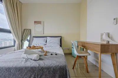 a bedroom with a bed with a desk and a desk at Stylish M Vertica 4 Bedroom Walk to MRT Velocity Mall in Kuala Lumpur