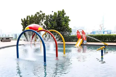 a pool with a water park with a water slide at Stylish M Vertica 4 Bedroom Walk to MRT Velocity Mall in Kuala Lumpur