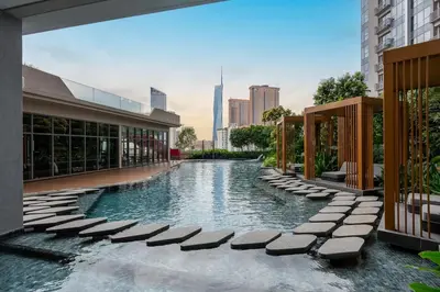 a swimming pool in the middle of a building at #TRX KL #2BR #4Pax #2Gbps #Netflix #Hotel Feel in Kuala Lumpur