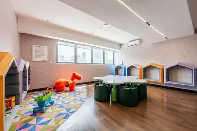 a childrens play room with a table and chairs at #TRX KL #2BR #4Pax #2Gbps #Netflix #Hotel Feel in Kuala Lumpur