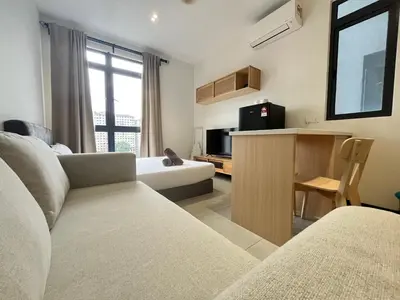 a living room with a couch and a television at Arte Plus Ampang By Comfortcorner in Kuala Lumpur