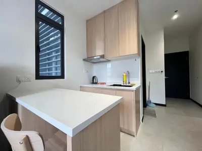 a kitchen with a white counter top and a window at Arte Plus Ampang By Comfortcorner in Kuala Lumpur