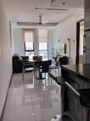 a kitchen and dining room with a table and chairs at Casa Residency apartment by Classy Homes in Kuala Lumpur