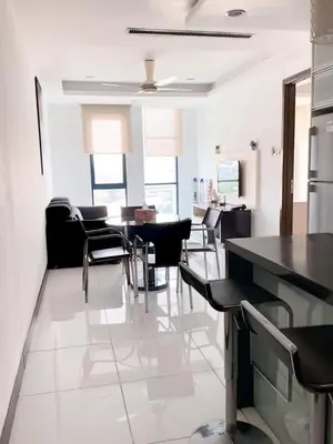 a kitchen and dining room with a table and chairs at Casa Residency apartment by Classy Homes in Kuala Lumpur