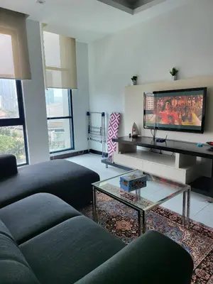 a living room with two couches and a tv at Casa Residency apartment by Classy Homes in Kuala Lumpur