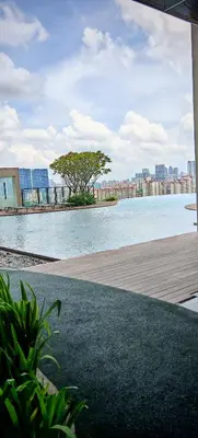 a large body of water with a city in the background at View KLCC 3 Bedroom Homestay Kenwingston Platz in Kuala Lumpur