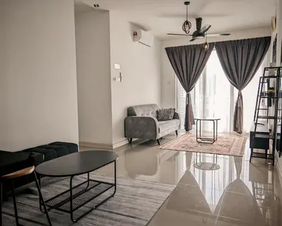 a living room with a couch and a table at Puncak Sentul KL with 3 Bedroom Homestay in Kuala Lumpur