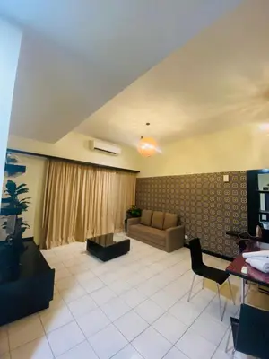 a living room with a couch and a table at Seri Bukit Ceylon Dreamy Destiny luxe Suites in Kuala Lumpur