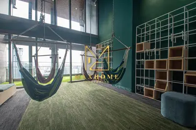 a room with two hammocks hanging from a wall at Maxhome Cozy at Riveria KL in Kuala Lumpur