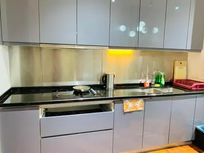 a stainless steel kitchen with a stove top oven at KLCC The Mews Luxury suites Malaysia in Kuala Lumpur