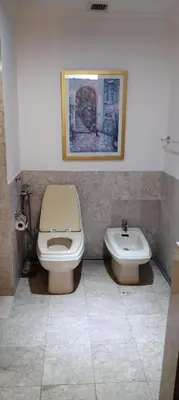 a bathroom with a toilet and a sink at SkS Service suite at times square in Kuala Lumpur