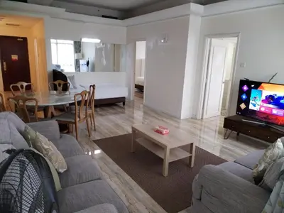a living room with a couch and a table at SkS Service suite at times square in Kuala Lumpur