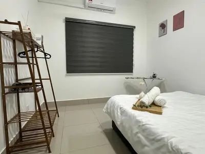 a room with a ladder next to a bed at KL City 3BR 3Bath Condo , Razak city ,TV box & Pool in Kuala Lumpur