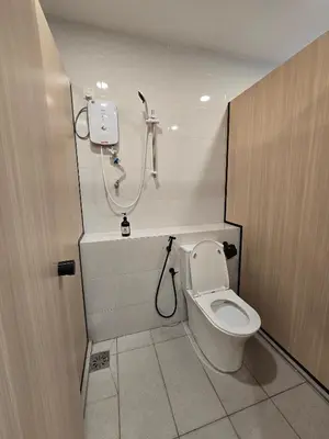 a bathroom with a toilet and a shower at Seko Suites by Aurelius Chow Kit in Kuala Lumpur