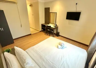 a hotel room with a bed and a mirror at Swing & Pillows - Bukit Bintang City Centre in Kuala Lumpur