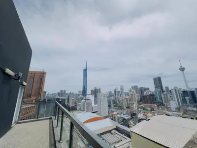 a view of a city from a balcony of a building at Bukit Bintang Fairlane suite by Rose in Kuala Lumpur