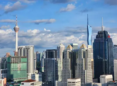 a view of a large city with skyscrapers at Cozy Chambers Studio KLCC Grand Opening Sale in Kuala Lumpur