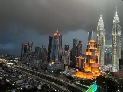 a city skyline at night with many tall buildings at Legasi Kampong Baru By AMNA for Malay Only in Kuala Lumpur