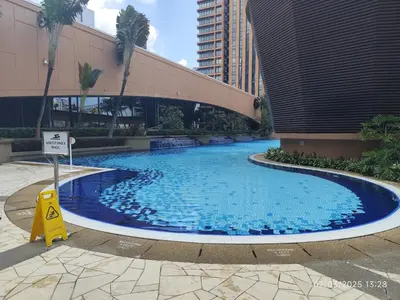 a large swimming pool in the middle of a building at The Golden Suites at Berjaya Times Square Kuala Lumpur in Kuala Lumpur