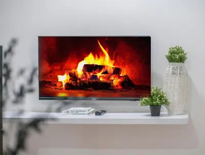 a tv sitting on a table with a fireplace at Neu Suites Ampang near Gleneagles in Kuala Lumpur