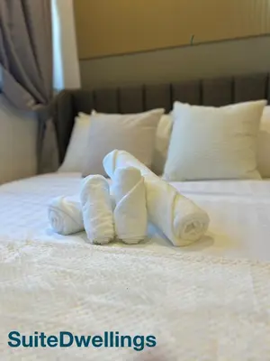 two towels on a bed in a hotel room at TheRiv Boutique Suites at Riveria City KL Sentral by Suite Dwellings in Kuala Lumpur