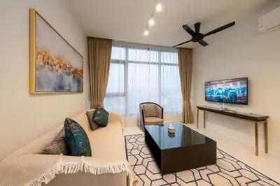 a living room with a couch and a table at La Gente X Pavilion Embassy Serviced Suites in Kuala Lumpur