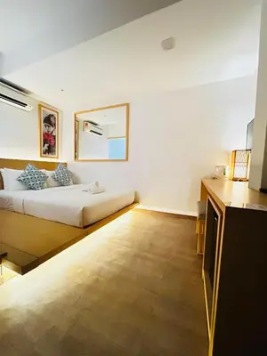 a bedroom with a bed and a mirror on the wall at Vivids Hotel Bukit Bintang in Kuala Lumpur