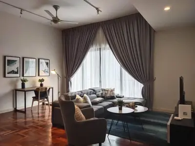 a living room with a couch and a table at The Mews KLCC by Homebrickz in Kuala Lumpur