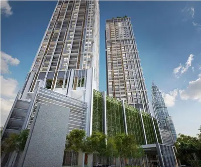 two tall buildings with trees in front of them at The Mews KLCC by Homebrickz in Kuala Lumpur