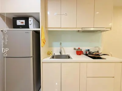 a small kitchen with a sink and a refrigerator at Damas Suite Sri Hartamas 4 pax Link to Mall in Kuala Lumpur