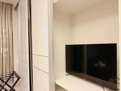 a flat screen tv on a wall in a room at Damas Suite Sri Hartamas 4 pax Link to Mall in Kuala Lumpur
