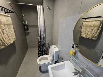 a bathroom with a toilet and a sink and a mirror at Ourstay M Vertica 49th floor Kuala Lumpur City View near Ikea with level 1 car park & 6 minutes walk to Maluri MRT in Kuala Lumpur