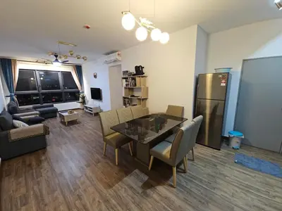 a living room with a table and chairs and a refrigerator at Ourstay M Vertica 49th floor Kuala Lumpur City View near Ikea with level 1 car park & 6 minutes walk to Maluri MRT in Kuala Lumpur