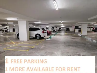an empty parking lot with cars parked in it at Ourstay M Vertica 49th floor Kuala Lumpur City View near Ikea with level 1 car park & 6 minutes walk to Maluri MRT in Kuala Lumpur