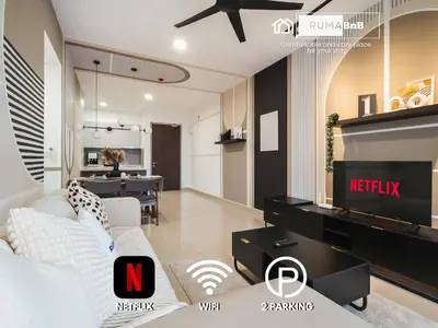 a living room with a couch and a tv at Trendy 3BR MVertica Near MRT by RumaBnB in Kuala Lumpur