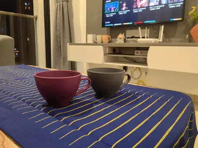 two cups sitting on top of a table with a tv at lavile 3 \u623f in Kuala Lumpur