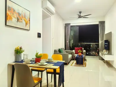 a living room with a table and chairs at lavile 3 \u623f in Kuala Lumpur