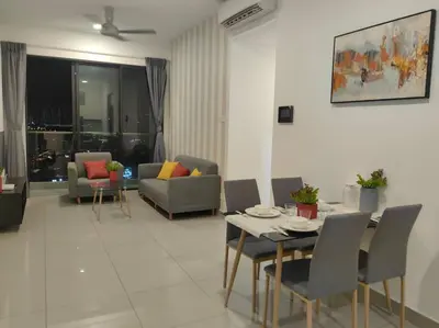 a living room with a table and chairs at lavile residence in Kuala Lumpur