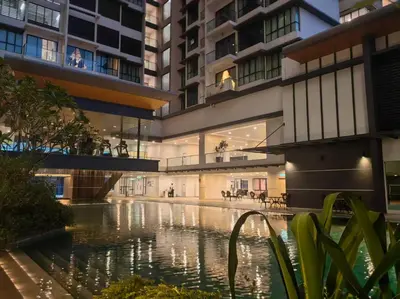 a building with a swimming pool in front of a building at lavile residence in Kuala Lumpur