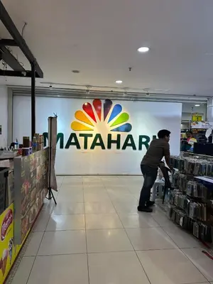 a man standing in front of a walmart sign in a store at Cozy 2BR Apt AxisAtrium Mall wPool Pandan Indah Ampang Kuala Lumpur in Ampang