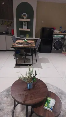 a living room with a table with a plant on it at #KLCC#LRT#Datum#Jelatek#Shopping #Internet 4G-5G in Kampong Datok Keramat