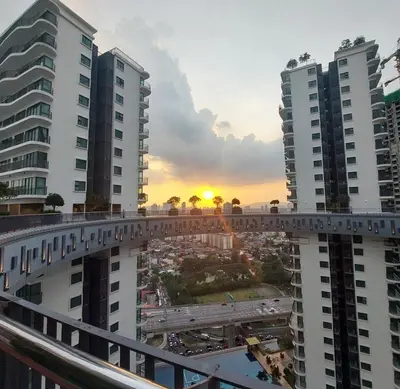 a bridge over a city with the sunset in the background at #KLCC#LRT#Datum#Jelatek#Shopping #Internet 4G-5G in Kampong Datok Keramat